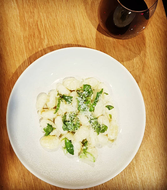 Gnocchi with Gorgonzola fonduta, broccoli stems and basil